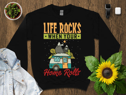 Black sweatshirt with "Life Rocks When Your Home Rolls" graphic and camper.