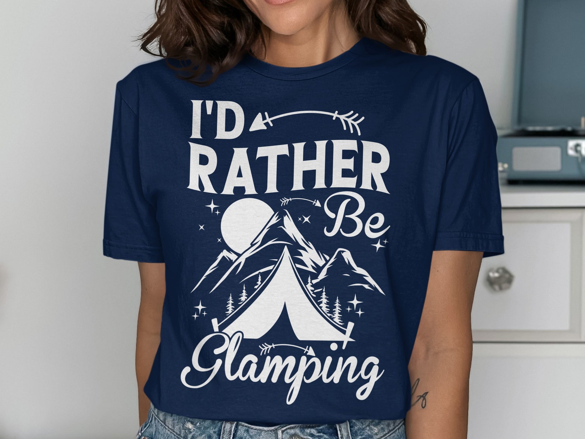Navy t-shirt with white text and graphics: "I'd rather Be Glamping" with a moon, mountains, and tent.