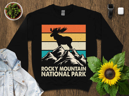 Black sweatshirt with vintage Rocky Mountain National Park moose and mountain design.