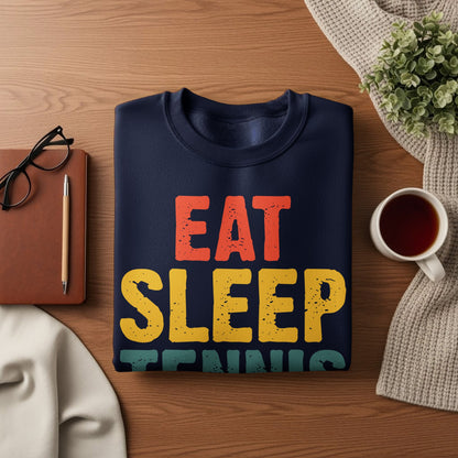 Navy sweatshirt with "EAT SLEEP TENNIS" text in red, yellow, and teal.