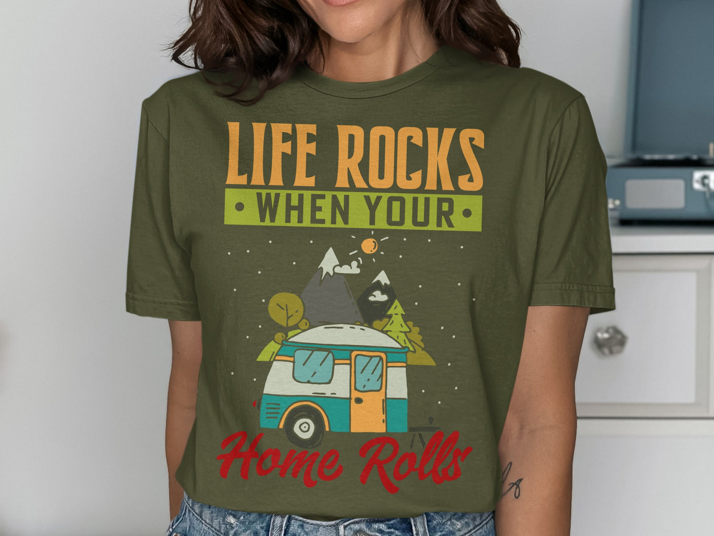 T-shirt with "Life Rocks When Your Home Rolls" and camper illustration.