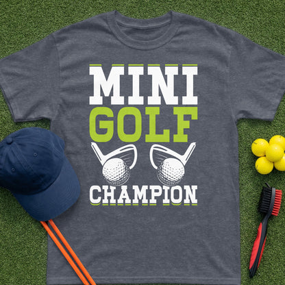 Dark grey t-shirt with "MINI GOLF CHAMPION" text and golf graphics.