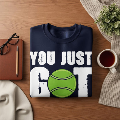 Navy sweatshirt with "YOU JUST GOT" and a tennis ball graphic.