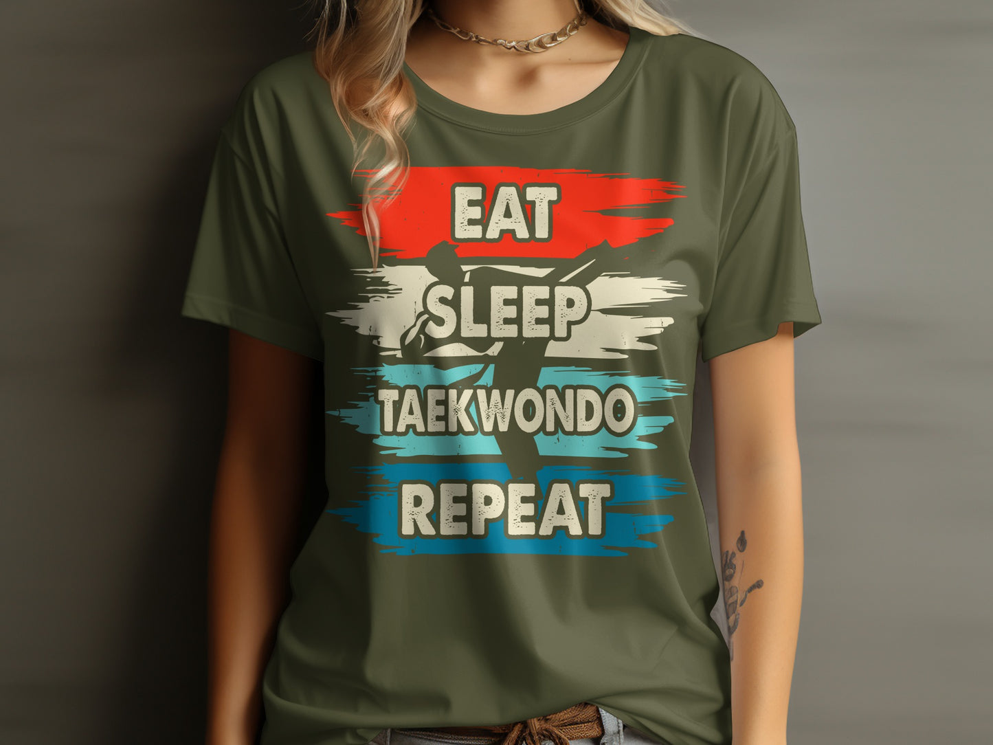 Green t-shirt with "Eat Sleep Taekwondo Repeat" in distressed white, red, and blue stripes.