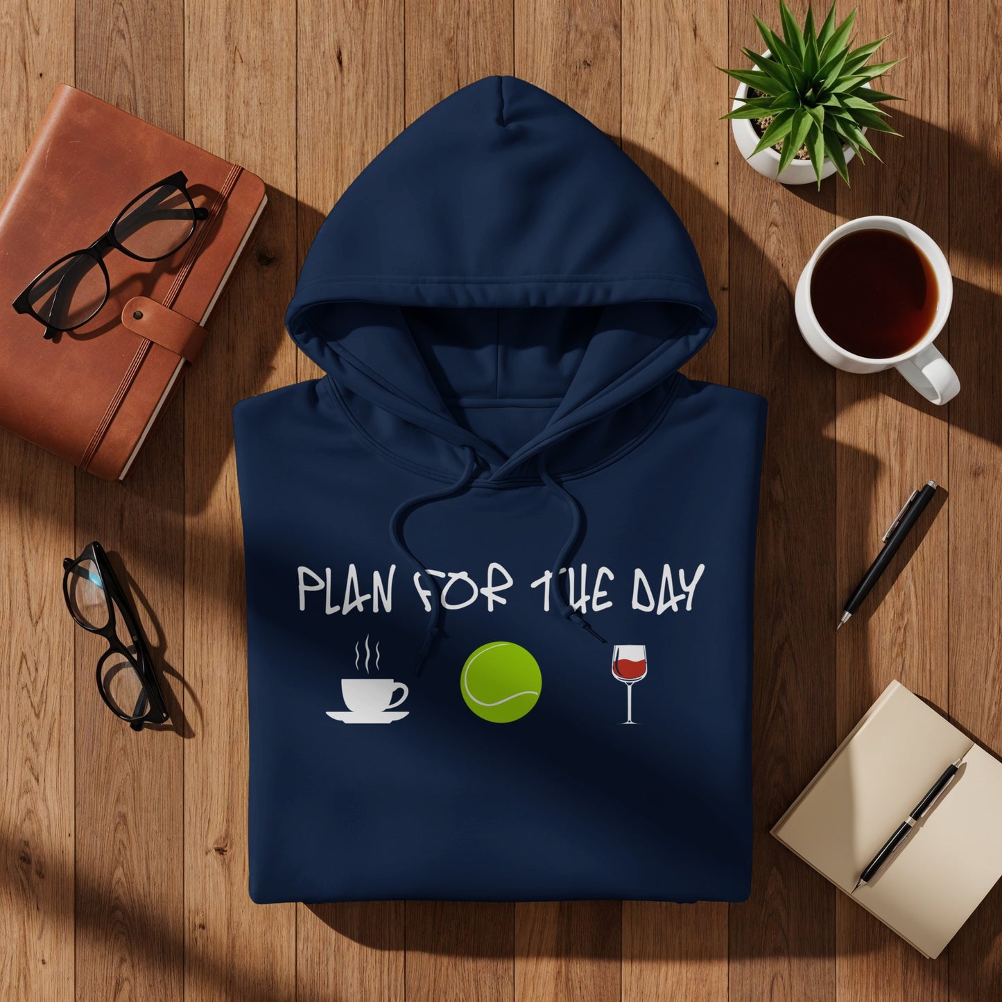 Navy hoodie with "Plan for the day" text and coffee, tennis, wine icons.