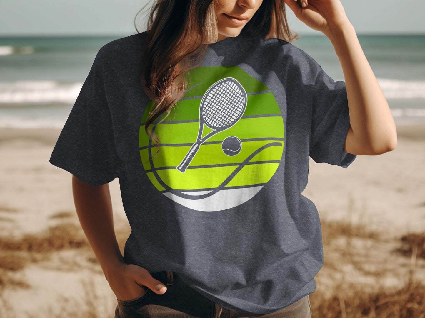 Tennis racket and ball graphic on a dark grey t-shirt.