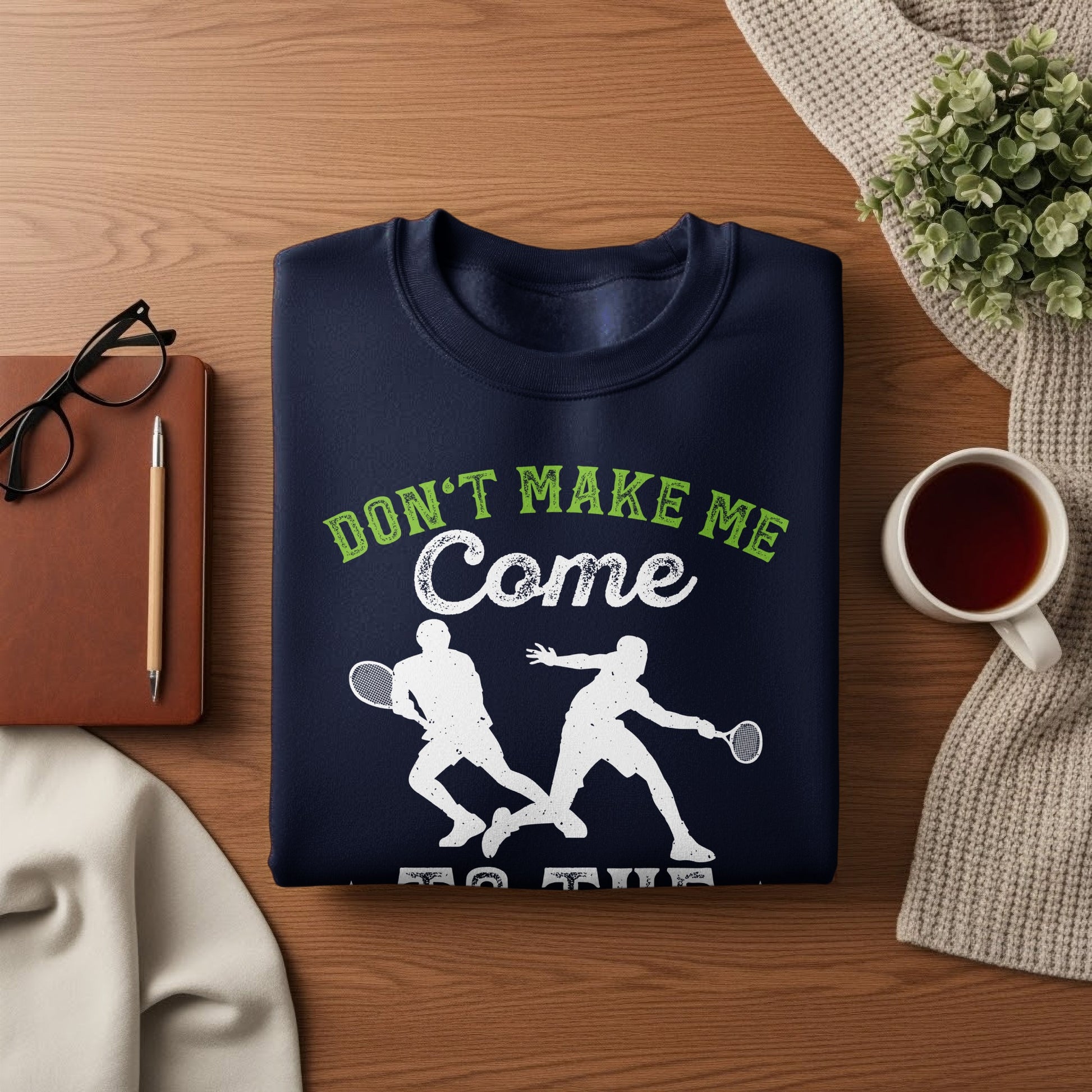 Navy sweatshirt with "Don't Make Me Come" graphic and tennis players.