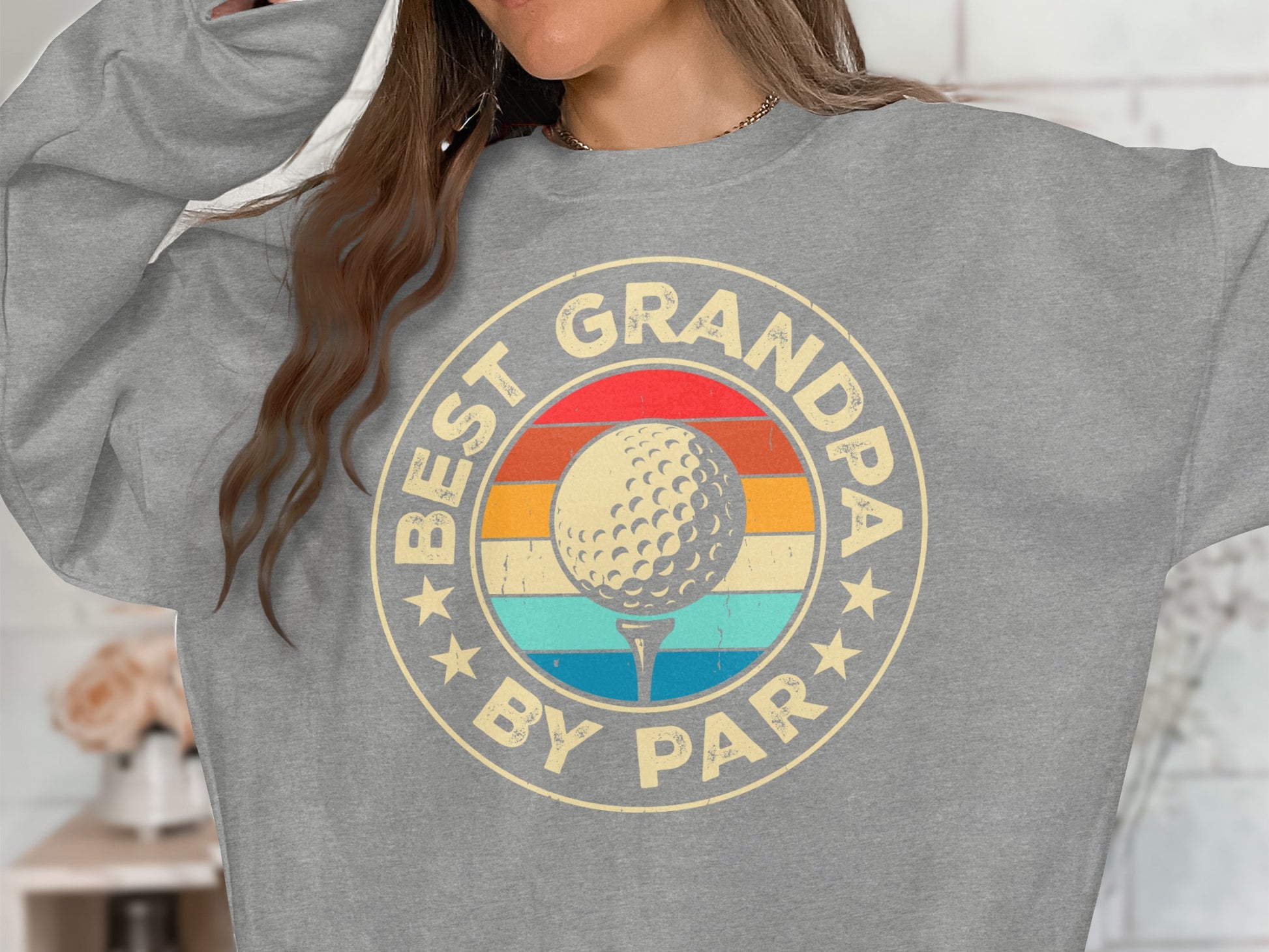 Gray sweatshirt with "Best Grandpa by Par" text and golf ball graphic.