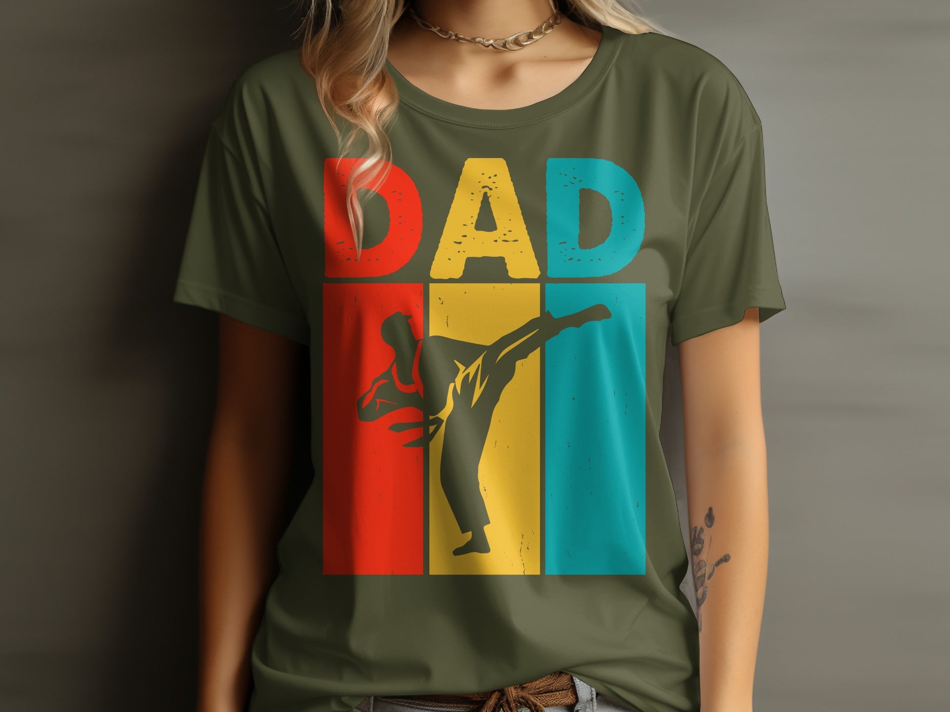 Green t-shirt with "DAD" in colorful blocks and a silhouette of a martial artist kicking.