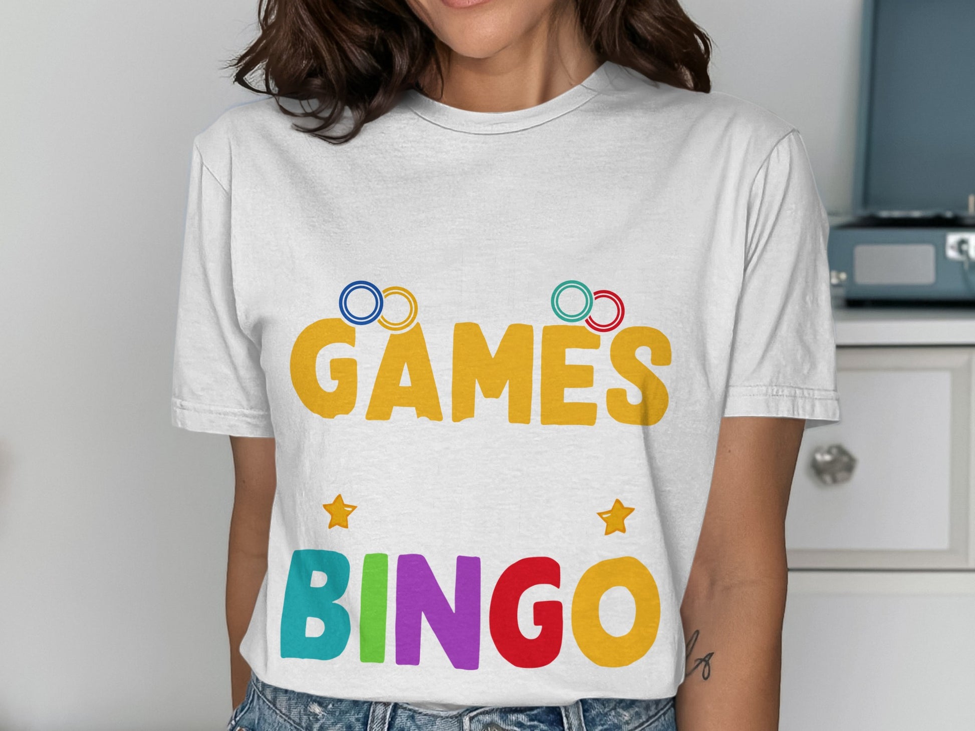 White t-shirt with colorful "GAMES BINGO" text and stars.