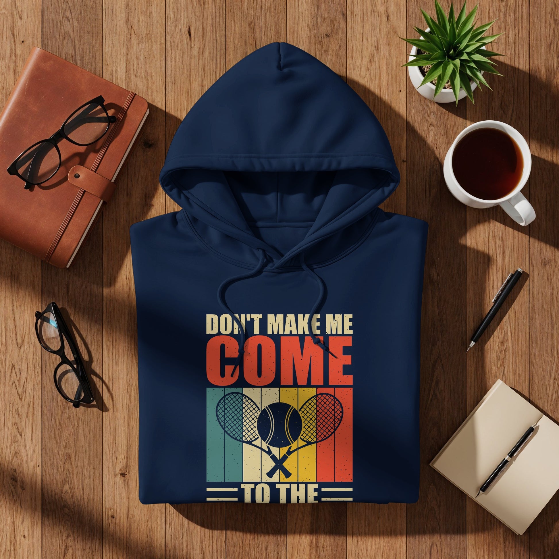 Navy hoodie with "Don't Make Me Come To The Tennis" graphic.