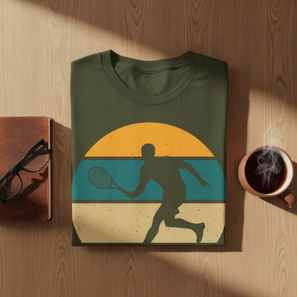 Olive green t-shirt with a vintage sunset tennis player graphic.