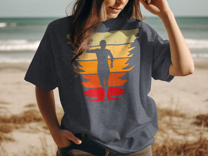 T-shirt with a sunset runner graphic on a beach.