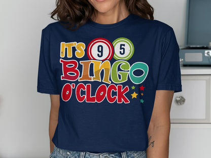 Navy t-shirt with "It's 9 5 Bingo O'Clock" text and colorful bingo balls.
