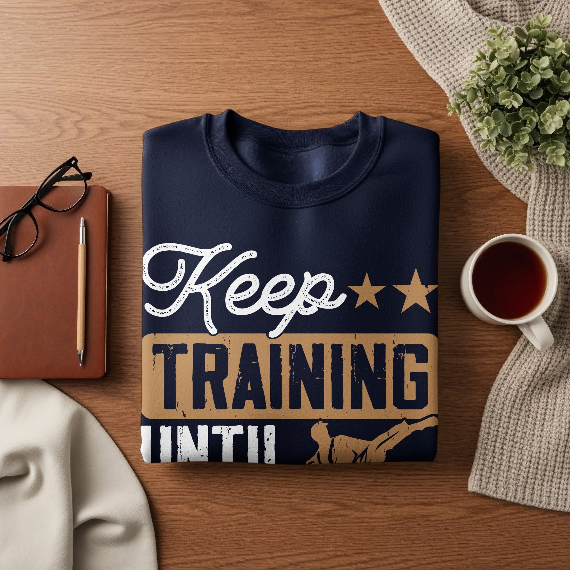 Navy sweatshirt with "Keep Training Until" text and a martial artist graphic.