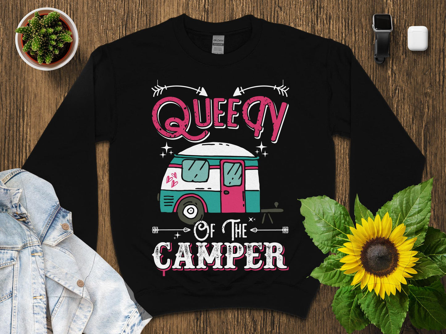 Black sweatshirt with "Queen of the Camper" text and a stylized camper van graphic.