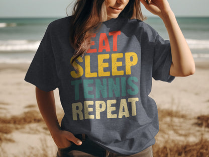 T-shirt with "Eat Sleep Tennis Repeat" text in colorful distressed font.