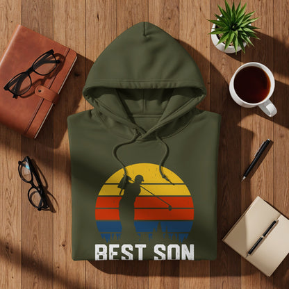 Olive green hoodie with a graphic of a golfer and a colorful sunset.