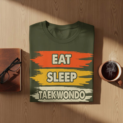 Olive green t-shirt with "Eat Sleep Taekwondo" text in distressed horizontal stripes.