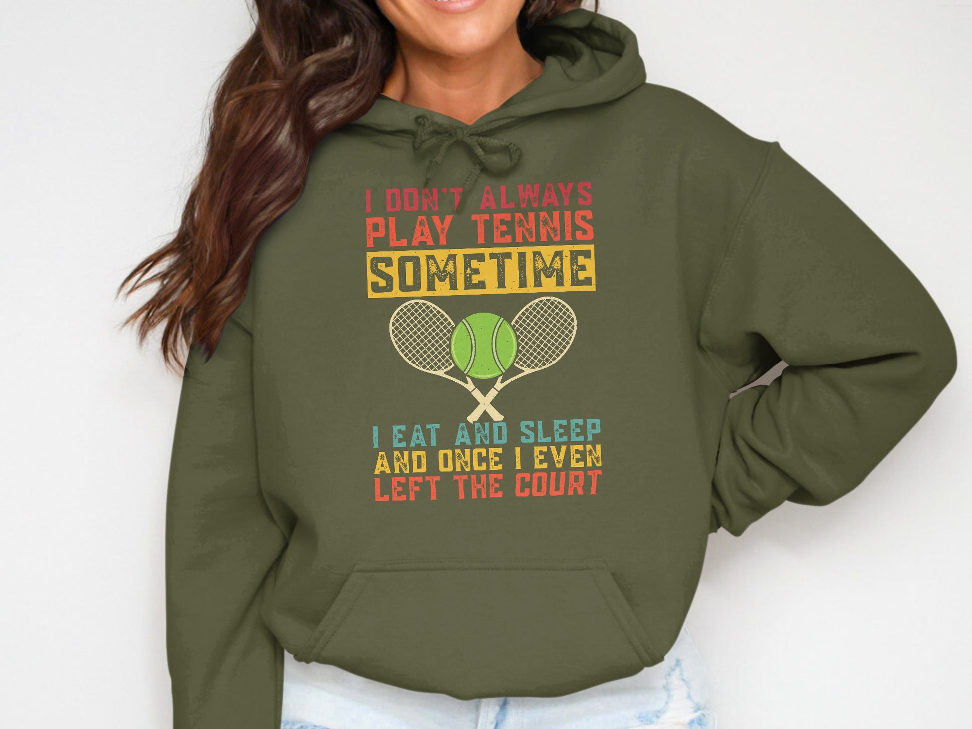Olive green hoodie with tennis graphic and text about playing tennis.