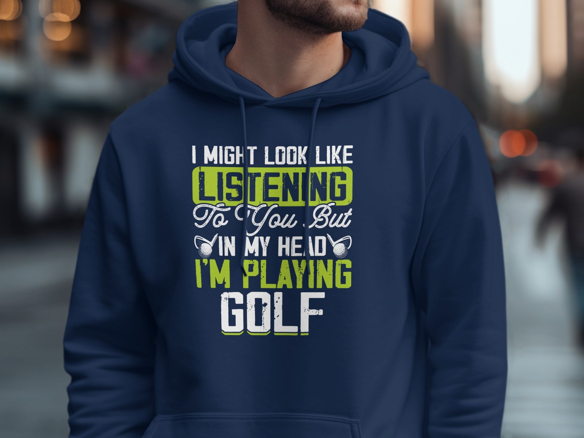 Navy hoodie with "I Might Look Like Listening To You But In My Head I'm Playing Golf" text.