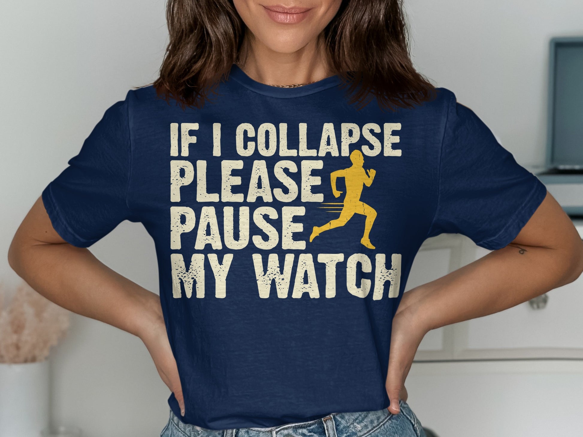Navy t-shirt with cream text "IF I COLLAPSE PLEASE PAUSE MY WATCH" and a runner graphic.