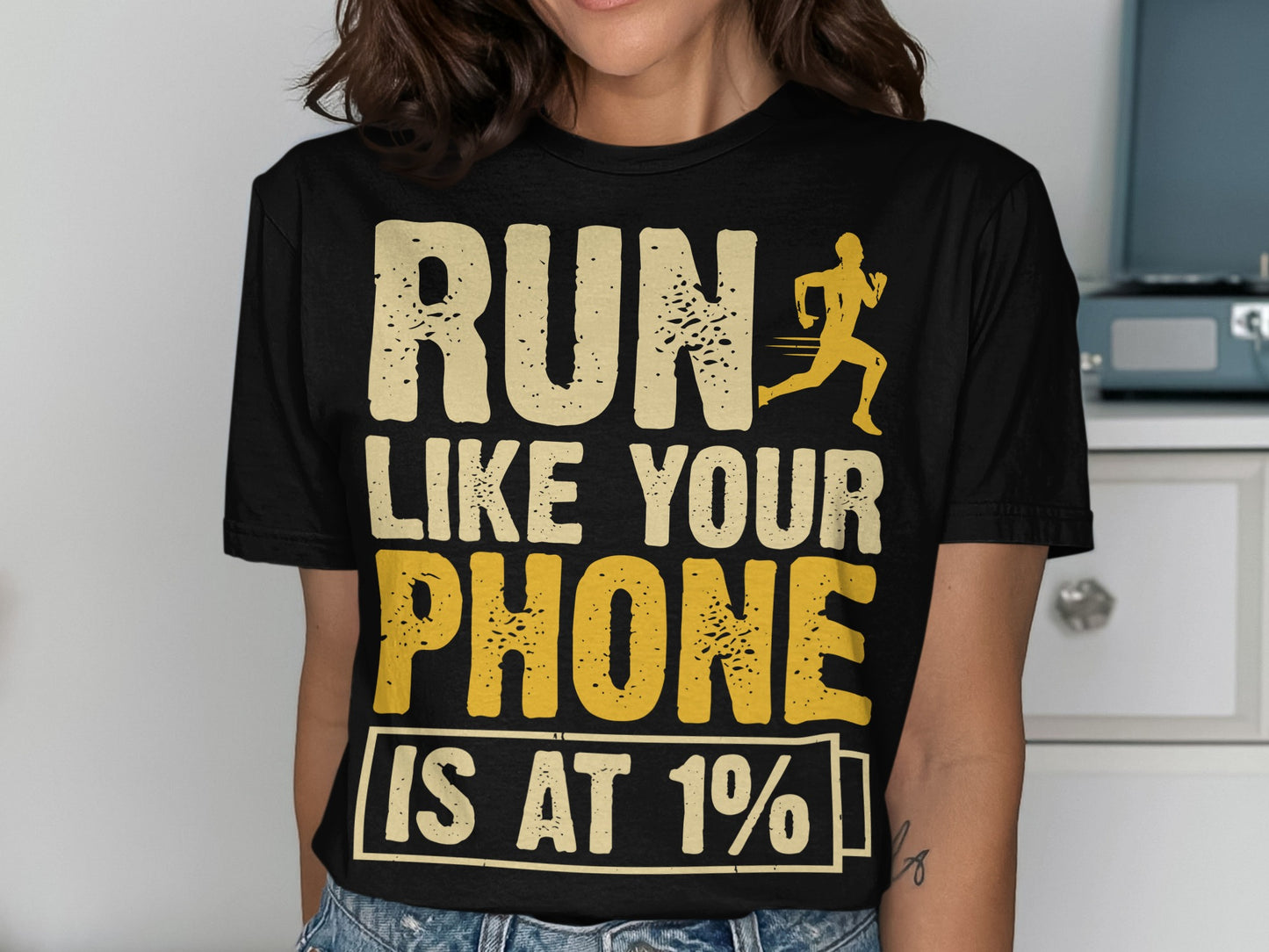 Black t-shirt with "RUN LIKE YOUR PHONE IS AT 1%" text and runner silhouette.