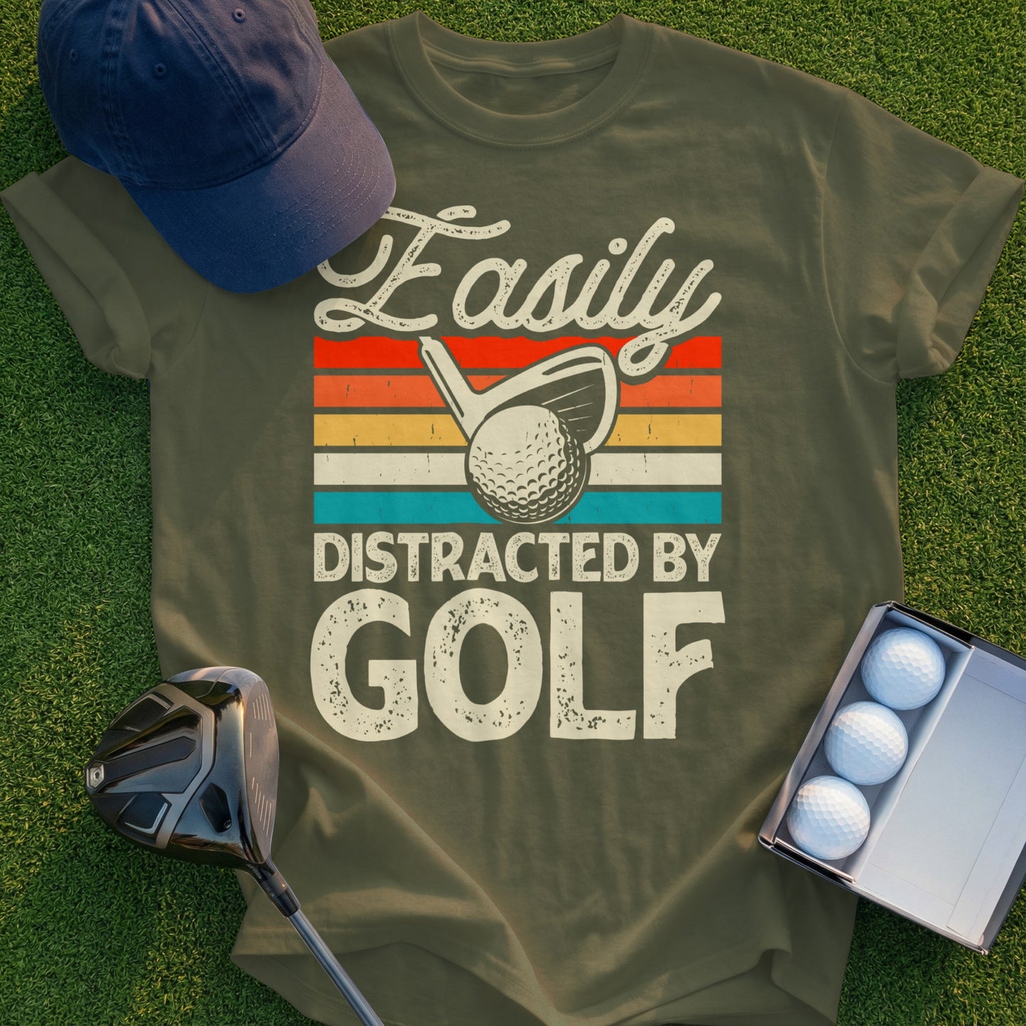 Olive green t-shirt with "Easily Distracted By GOLF" text and golf imagery.