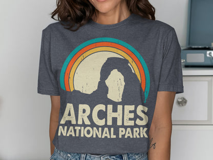 Dark gray t-shirt with retro rainbow and Delicate Arch design, Arches National Park text.