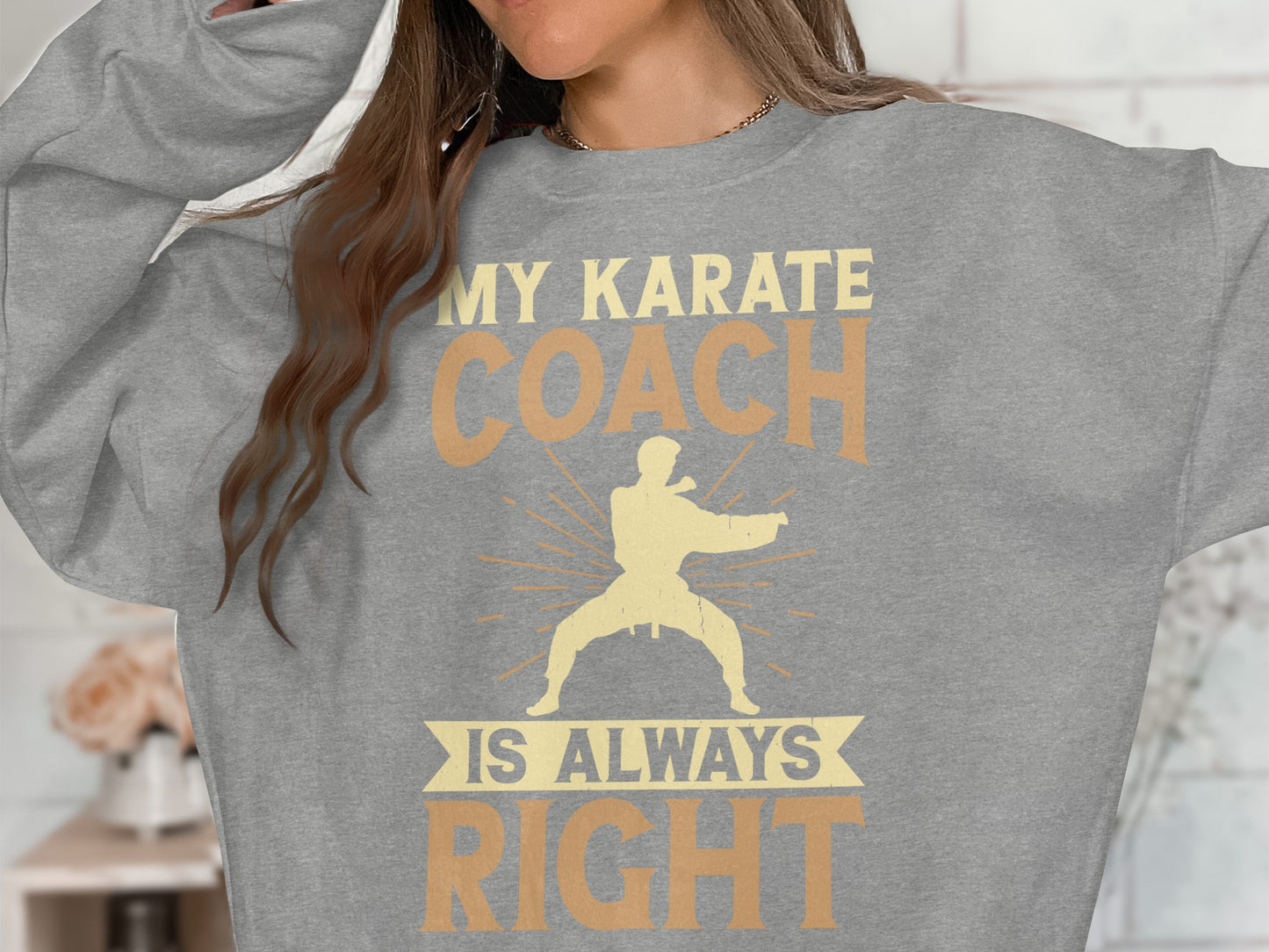 Gray sweatshirt with "My Karate Coach Is Always Right" text and martial artist graphic.
