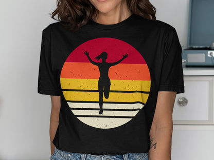 Runner silhouette arms raised against a colorful striped sunset circle.