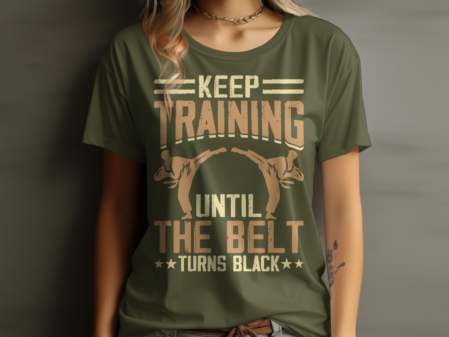 Green t-shirt with "Keep Training Until The Belt Turns Black" in a martial arts graphic.