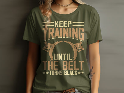Green t-shirt with "Keep Training Until The Belt Turns Black" in a martial arts graphic.