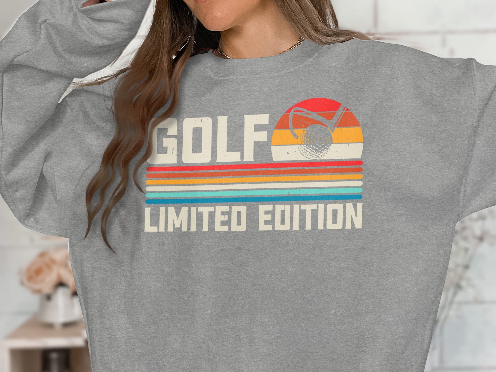 Gray sweatshirt with "Golf Limited Edition" and vintage golf sunset graphic.