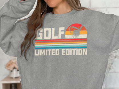 Gray sweatshirt with "Golf Limited Edition" and vintage golf sunset graphic.