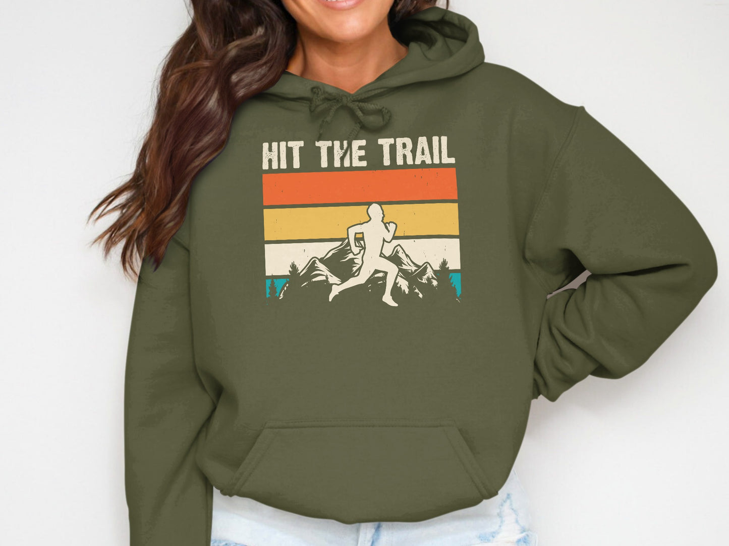 Green hoodie with "Hit the Trail" text and a runner in mountains graphic.