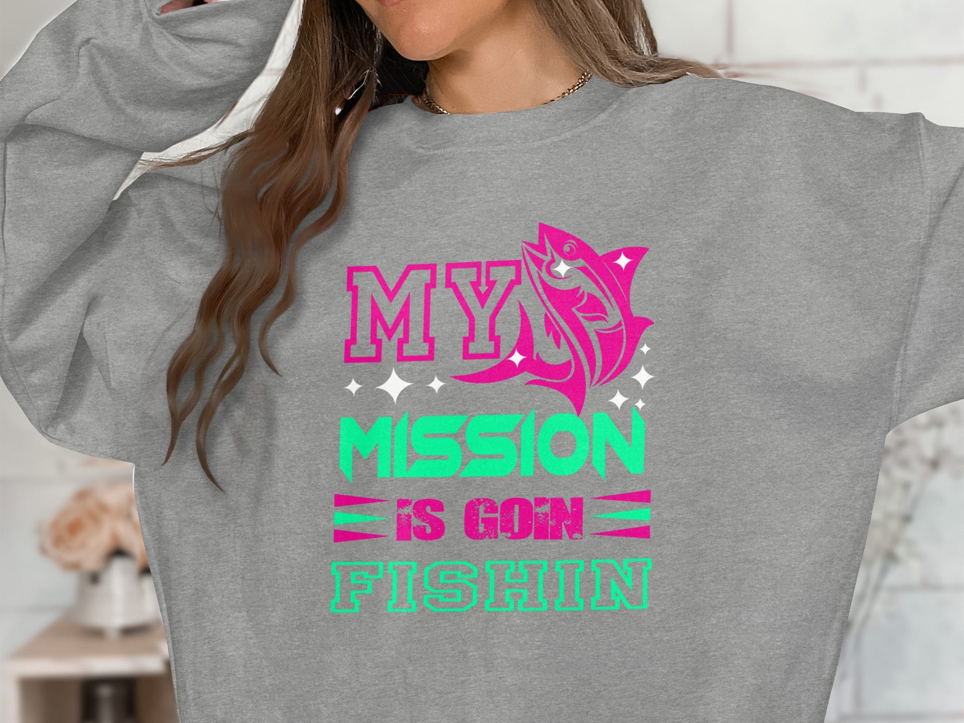 Grey sweatshirt with pink and green text "MY MISSION IS GOIN FISHIN".