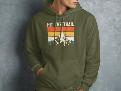 Green hoodie with "HIT THE TRAIL" text and mountain runner graphic.