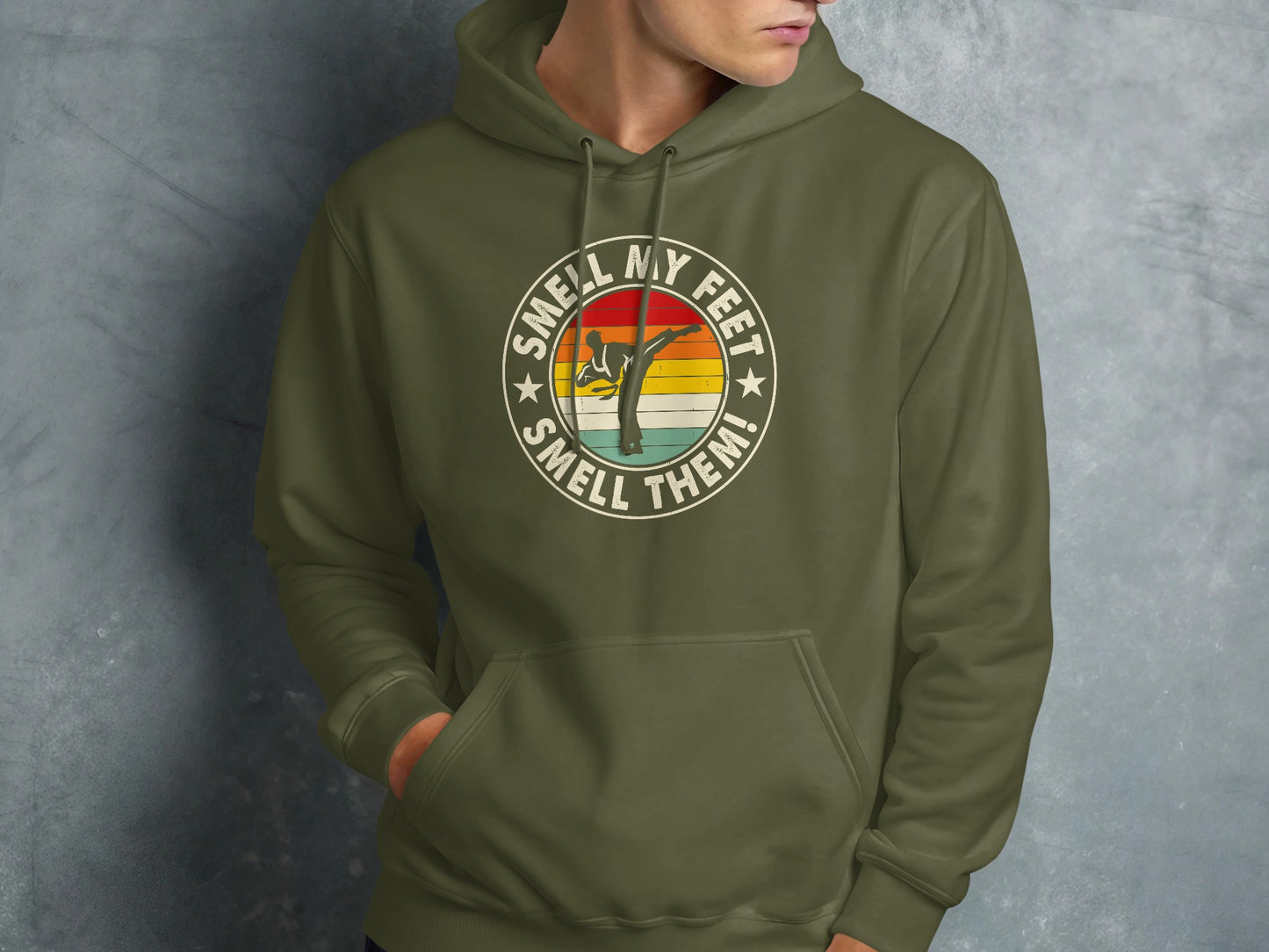 Green hoodie with a circular graphic featuring a martial artist and text.