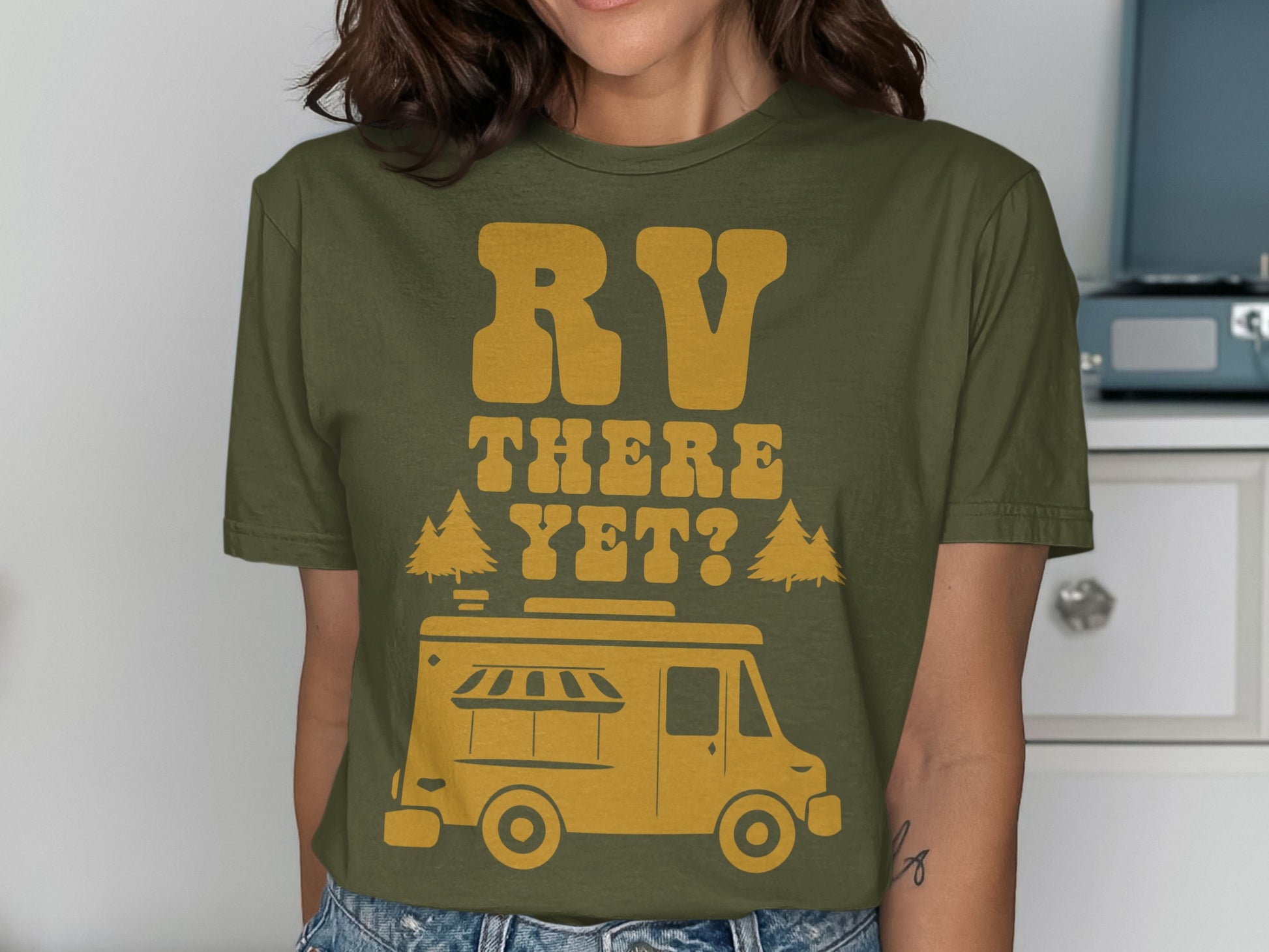 Olive green t-shirt with yellow graphic of RV and "RV THERE YET?" text.