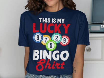 Dark blue t-shirt with "THIS IS MY LUCKY BINGO Shirt" and colorful bingo balls.