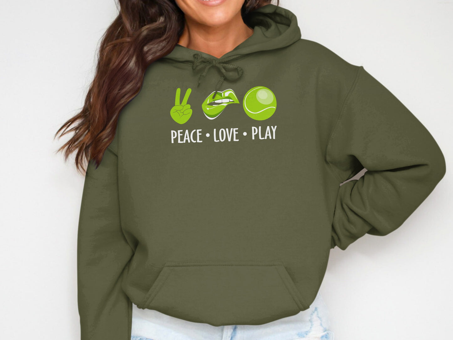 Green hoodie with peace sign, lips, and tennis ball graphic.