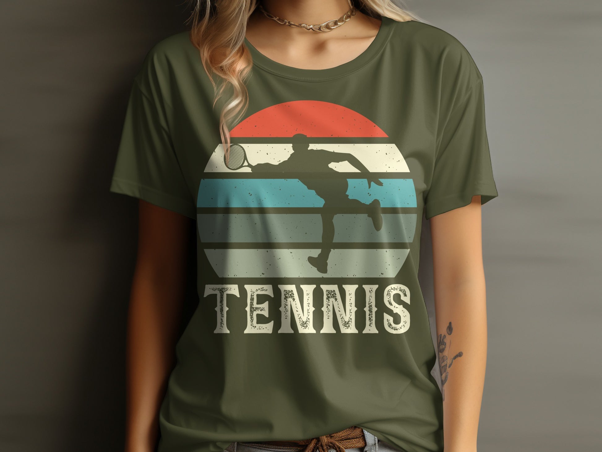 Olive green t-shirt with tennis player silhouette on striped sunset graphic.