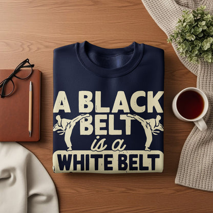 Navy sweatshirt with white text and karate silhouettes, "A BLACK BELT is a WHITE BELT".