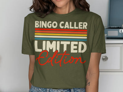 Olive green t-shirt with "Bingo Caller Limited Edition" text in colorful stripes and red script.
