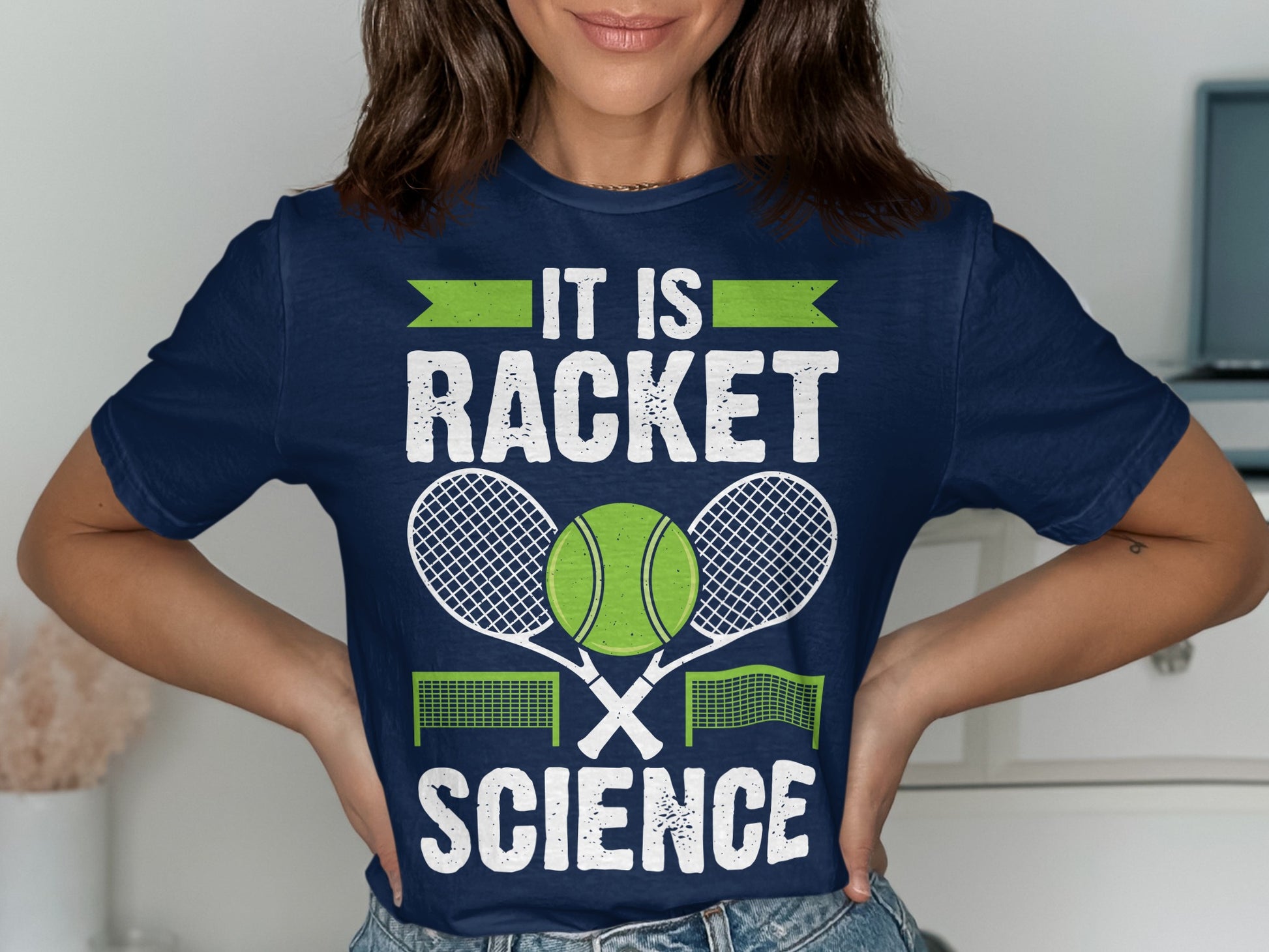 Navy t-shirt with "IT IS RACKET SCIENCE" and tennis rackets and balls.