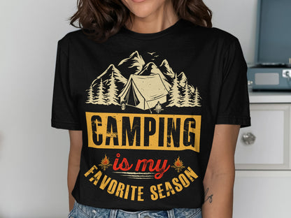 Black t-shirt with "Camping is my favorite season" text and mountain graphic.