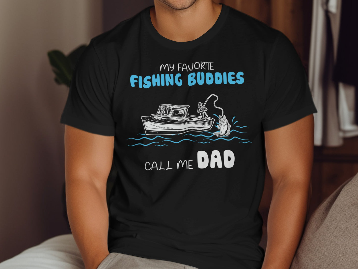 Black t-shirt with "My Favorite Fishing Buddies Call Me Dad" text and fishing graphic.