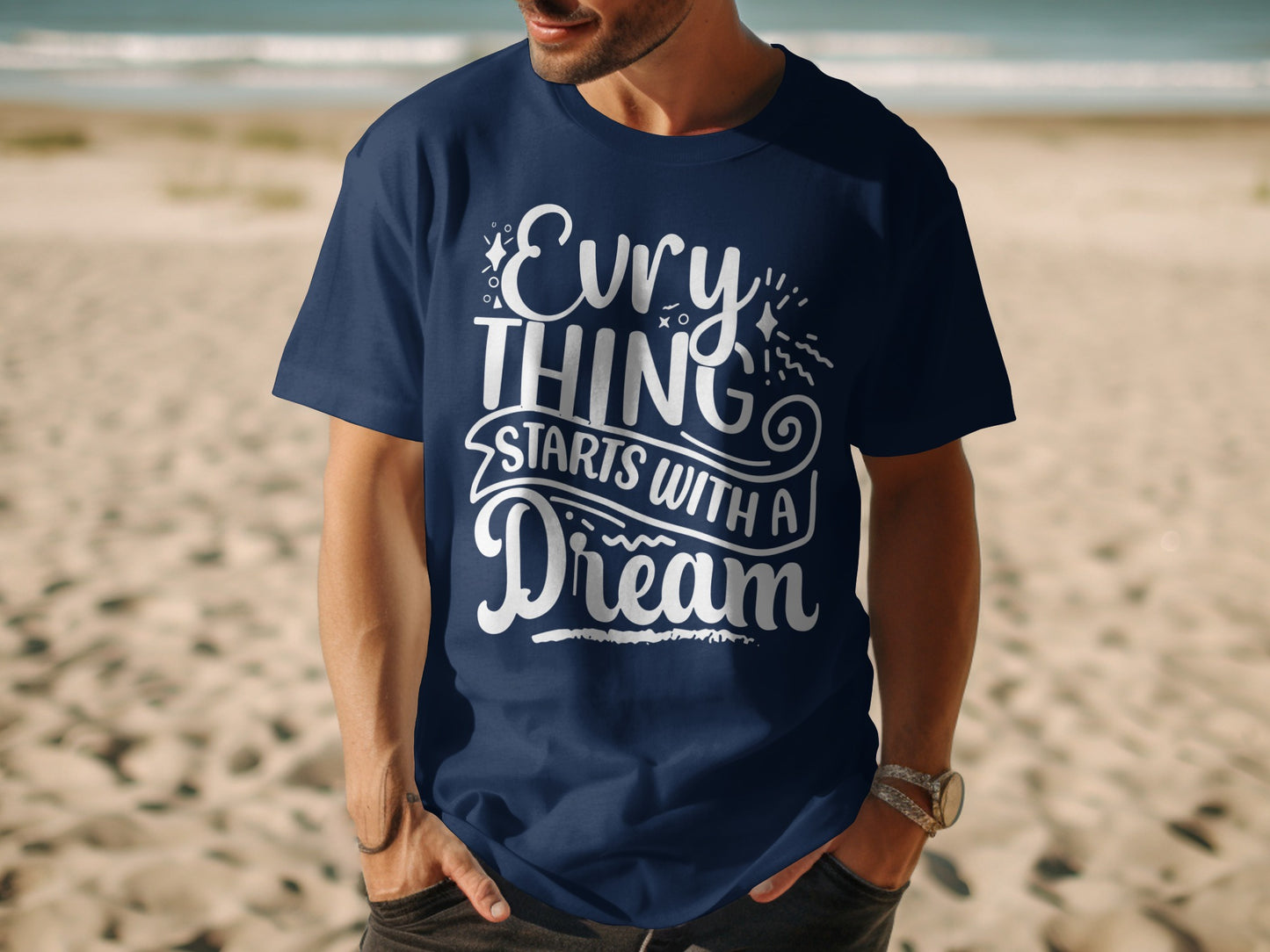 Dark blue t-shirt with "Everything starts with a dream" slogan in white.