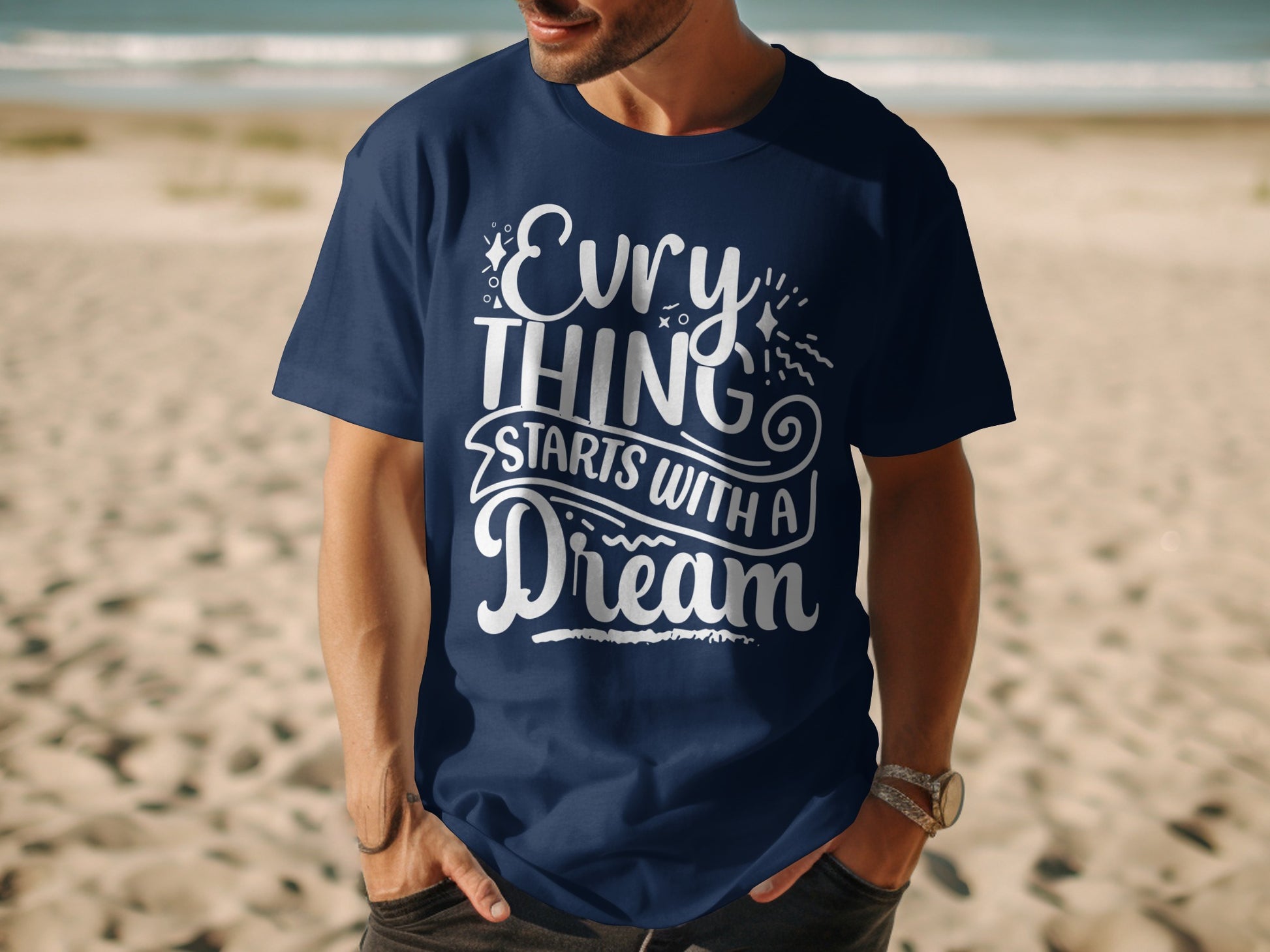 Dark blue t-shirt with "Everything starts with a dream" slogan in white.